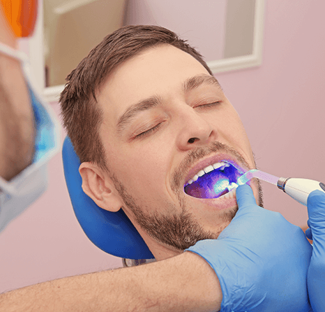 A dentist working on a patient.